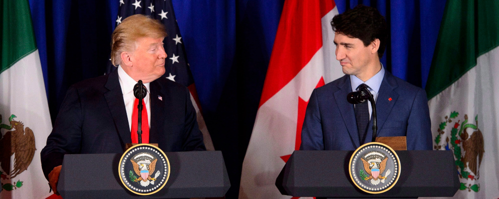 Prime Minister Justin Trudeau, right, and President of the United States Donald Trump participate in a signing ceremony for the new United States-Mexico-Canada Agreement with President of Mexico Enrique Pena Nieto (not shown) in Buenos Aires, Argentina on Friday, Nov. 30, 2018. Sean Kilpatrick/The Canadian Press.