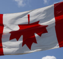 The Canadian flag is hung upside down just outside of Winnipeg, Monday, July 10, 2023. David Lipnowski/The Canadian Press. 