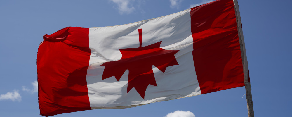 The Canadian flag is hung upside down just outside of Winnipeg, Monday, July 10, 2023. David Lipnowski/The Canadian Press. 