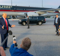 Former President Donald Trump speaks with reporters before departure from Hartsfield-Jackson Atlanta International Airport, Thursday, Aug. 24, 2023, in Atlanta. Alex Brandon/AP Photo. 