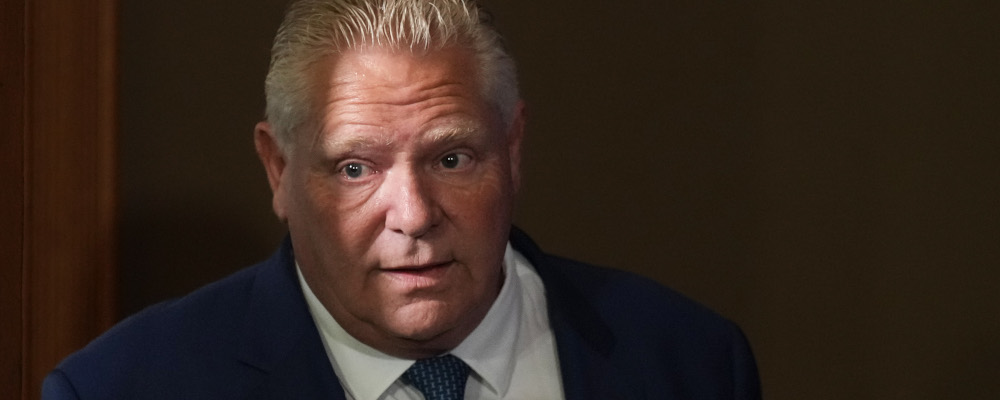Ontario Premier Doug Ford enters a room to speak to journalists at the Queen's Park Legislature in Toronto on Tuesday, September 5, 2023. Chris Young/The Canadian Press. 