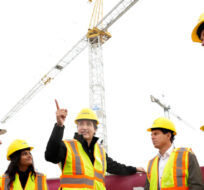 Canadian Prime Minister Justin Trudeau, centre, overlooks the construction of new housing in Brampton, Ont., Friday, Oct. 20, 2023. Nathan Denette/The Canadian Press. 