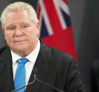 Ontario Premier Doug Ford, left speaks during a press conference as Toronto Mayor Olivia Chow, right, looks on at Toronto City Hall, in Toronto on Thursday, Feb. 22, 2024. Arlyn McAdorey/The Canadian Press. 