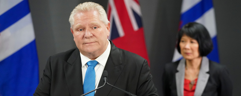 Ontario Premier Doug Ford, left speaks during a press conference as Toronto Mayor Olivia Chow, right, looks on at Toronto City Hall, in Toronto on Thursday, Feb. 22, 2024. Arlyn McAdorey/The Canadian Press. 