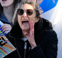 Pro-Israel protesters shout during a demonstration in front of a synagogue hosting "the Great Israeli Real Estate Event," in Thornhill, Ont., Thursday, March 7, 2024. Frank Gunn/The Canadian Press. 