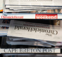 Newspapers owned by SaltWire Network Inc. are photographed in Halifax on Tuesday, March 12, 2024. A media expert says the decision by Atlantic Canada's largest newspaper company to seek protection from its creditors is another sign of the accelerating decline of the newspaper business. Darren Calabrese/The Canadian Press