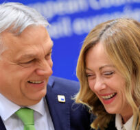 Hungary's Prime Minister Viktor Orban, left, speaks with Italy's Prime Minister Giorgia Meloni during a round table meeting at an EU Summit in Brussels, Thursday, March 21, 2024. Geert Vanden Wijngaert/AP Photo. 