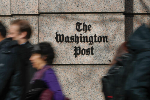 In this Thursday, Feb. 21, 2019, file photo, people walk by the One Franklin Square Building, home of The Washington Post newspaper, in downtown Washington. Pablo Martinez Monsivais/AP Photo. 