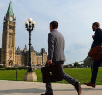 People make their way to the centre block as the House of Commons on Parliament Hill in Ottawa on Monday, Sept. 18, 2017. Sean Kilpatrick/The Canadian Press. 