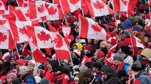 Fans cheer and wave Canadian flags before the start of the Canada-Jamaica CONCACAF World Cup soccer qualifying action in Toronto on Sunday, March 27, 2022. Frank Gunn/The Canadian Press. 