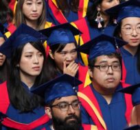 Spring 2020 graduates listen during a convocation ceremony at Simon Fraser University, in Burnaby, B.C., on Friday, May 6, 2022. Darryl Dyck/The Canadian Press. 