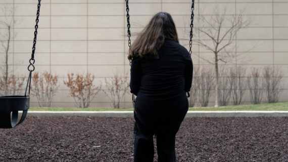A teen girl sits for a portrait in a park near her home in Illinois on Friday, March 24, 2023. Erin Hooley/AP Photo. 