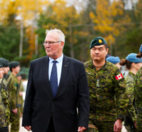 A Quarter Guard welcomes Minister of National Defence Bill Blair as he arrives to an announcement Petawawa, Ont., on Thursday, Oct. 19, 2023. Sean Kilpatrick/The Canadian Press. 