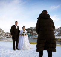 Newlyweds Jordan and Alicia Greene pose for their wedding pictures in historic Quidi Vidi in St. John's on Saturday, January 6, 2024. Paul Daly/The Canadian Press. 