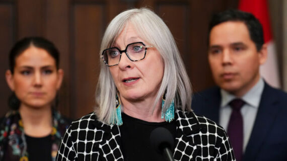 Indigenous Services Minister Patty Hajdu stands with Cassidy Caron, President of the Metis National Council, and Natan Obed, President of the Inuit Tapiriit Kanatami, speals about An Act respecting First Nations, Inuit and Métis children, youth and families (C-92) on Parliament Hill in Ottawa on Feb. 10, 2024. Sean Kilpatrick/The Canadian Press. 