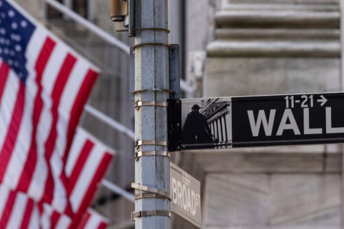 Wall Street sign is seen outside the New York Stock Exchange,  Thursday, March. 21, 2024. Yuki Iwamura/AP Photo. 