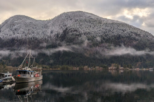 Snow blankets the mountains over the village of Zeballos, B.C., is located along the northwest coast of Vancouver Island is shown on April 3, 2024. Chad Hipolito/The Canadian Press.