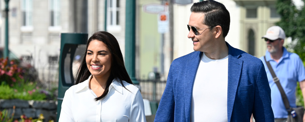 Conservative Leader Pierre Poilievre and his wife Anaida walk to a news conference in Quebec City, Wednesday, Sept. 6, 2023. Jacques Boissinot/The Canadian Press. 
