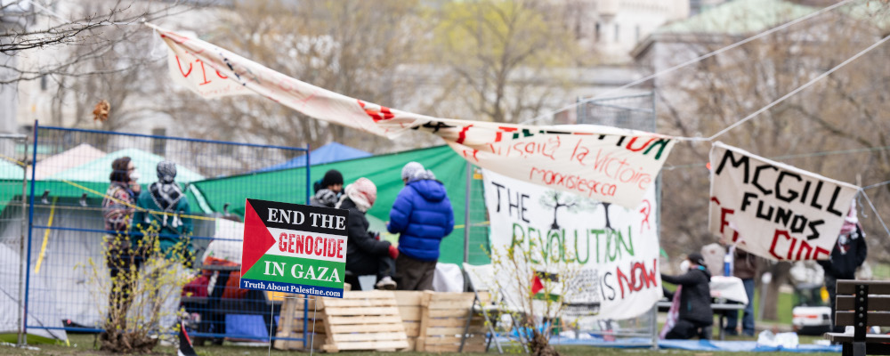 Pro-Palestinian activists are seen in their encampment set up on McGill University's campus in Montreal, Monday, April 29, 2024. Christinne Muschi/The Canadian Press. 