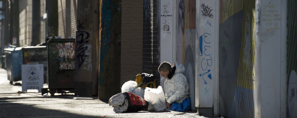 A man sits in an alleywat in Vancouver's Downtown Eastside, Wednesday, Feb. 6, 2019. Jonathan Hayward/The Canadian Press. 